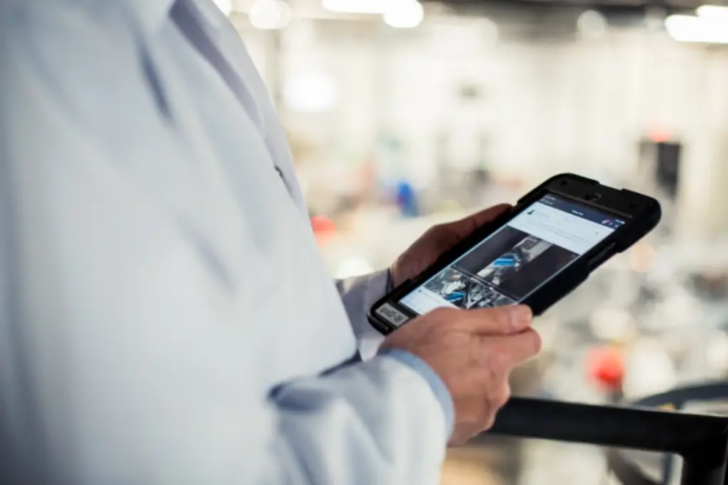 A person holding an ipad.