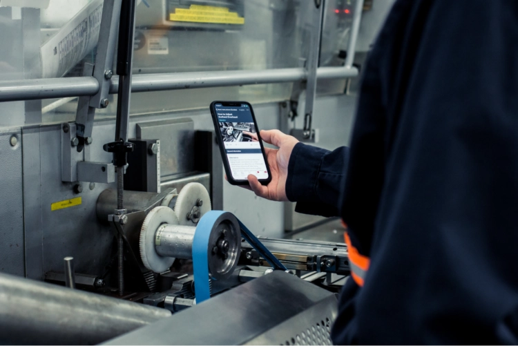 A person viewing machine instructions on a mobile device